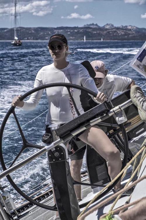 Co-owner of Comanche, Kristy Heinze-Clark driving her world record holding supermaxi in Marina Porto Cervo, Sardinia, during racing on Day 1 of the Rolex Maxi World Cup. A try-out for the upcoming Rolex Sydney-Hobart? © SW